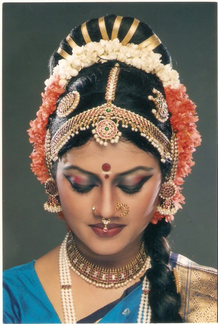Close portrait in bridal-style Kuchipudi makeup and jewellery, eyes closed