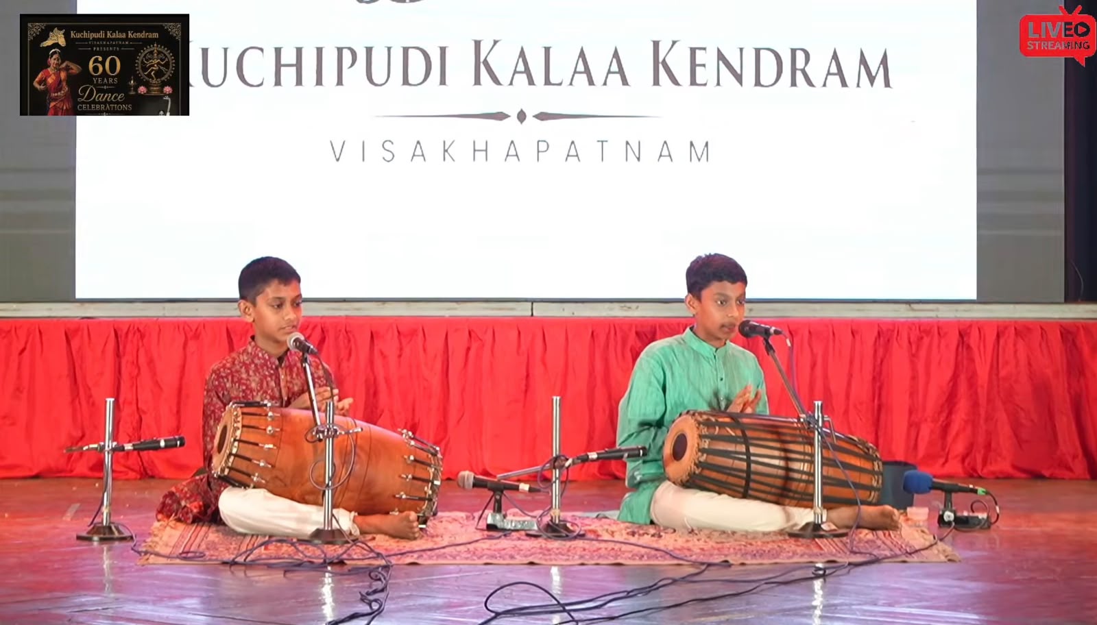Two young mridangam students performing at Kuchipudi Kalaa Kendram's 60th anniversary celebrations